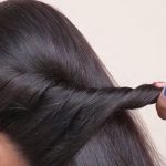 rolling sections of hair back