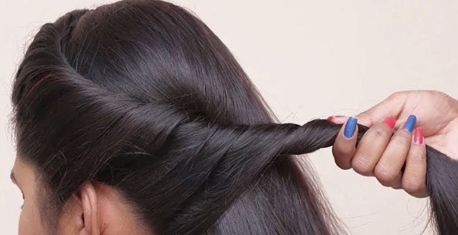rolling sections of hair back